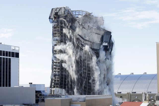 A photograph showing the Trump Plaza building collapsing